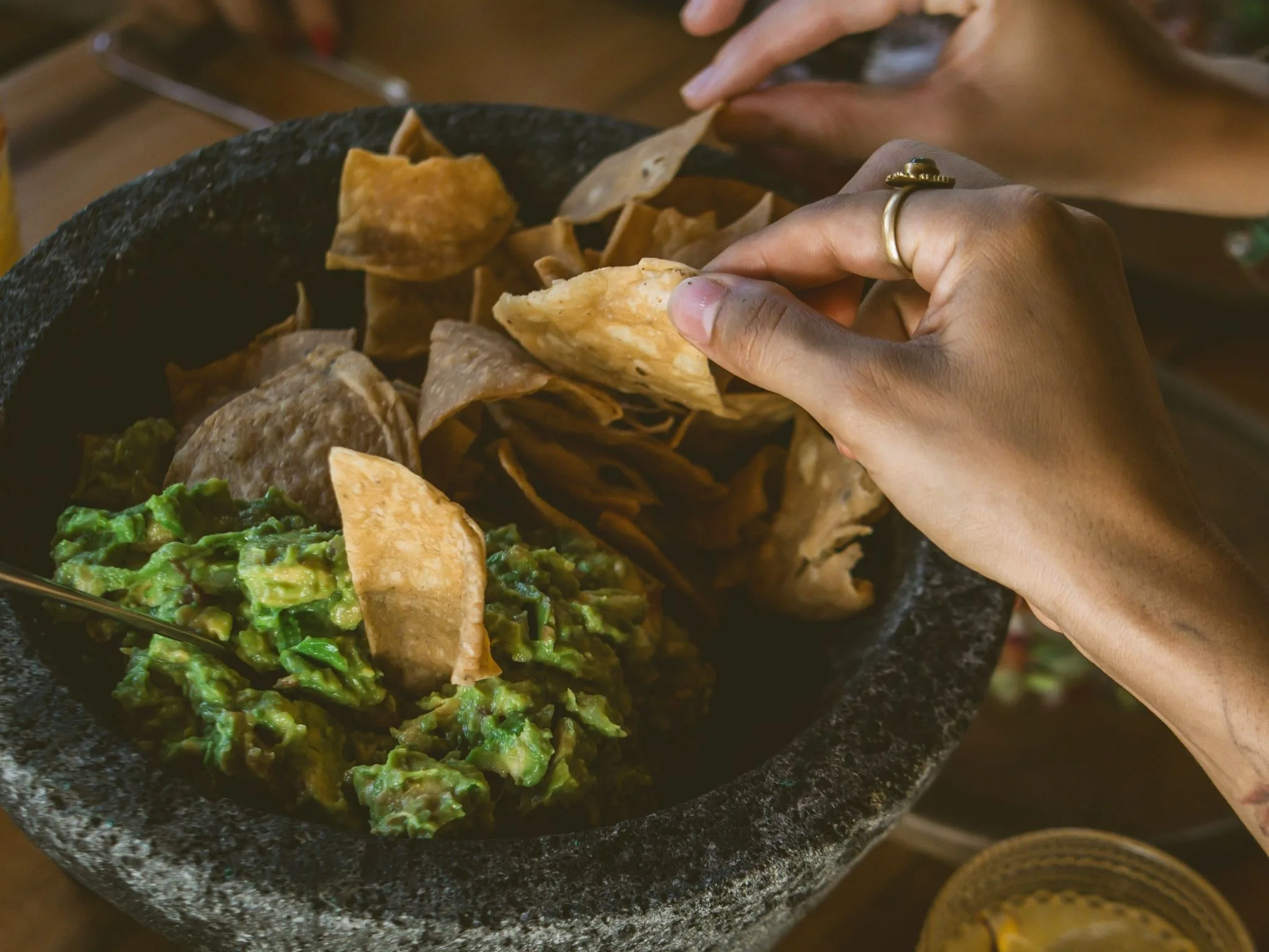 Guests cooking on the comal at Cachasol Farm Distillery culinary workshop, Sayulita Nayarit