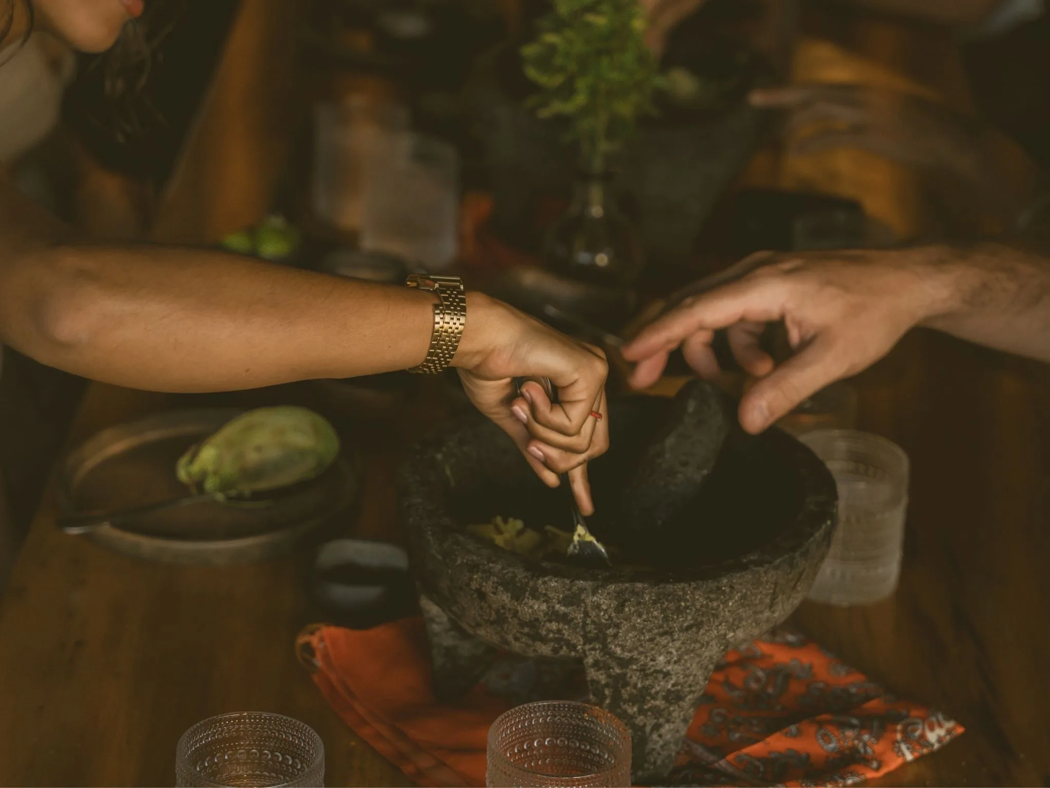 Hands making tortillas on the comal at Cachasol Farm Distillery cooking class, Sayulita Nayarit